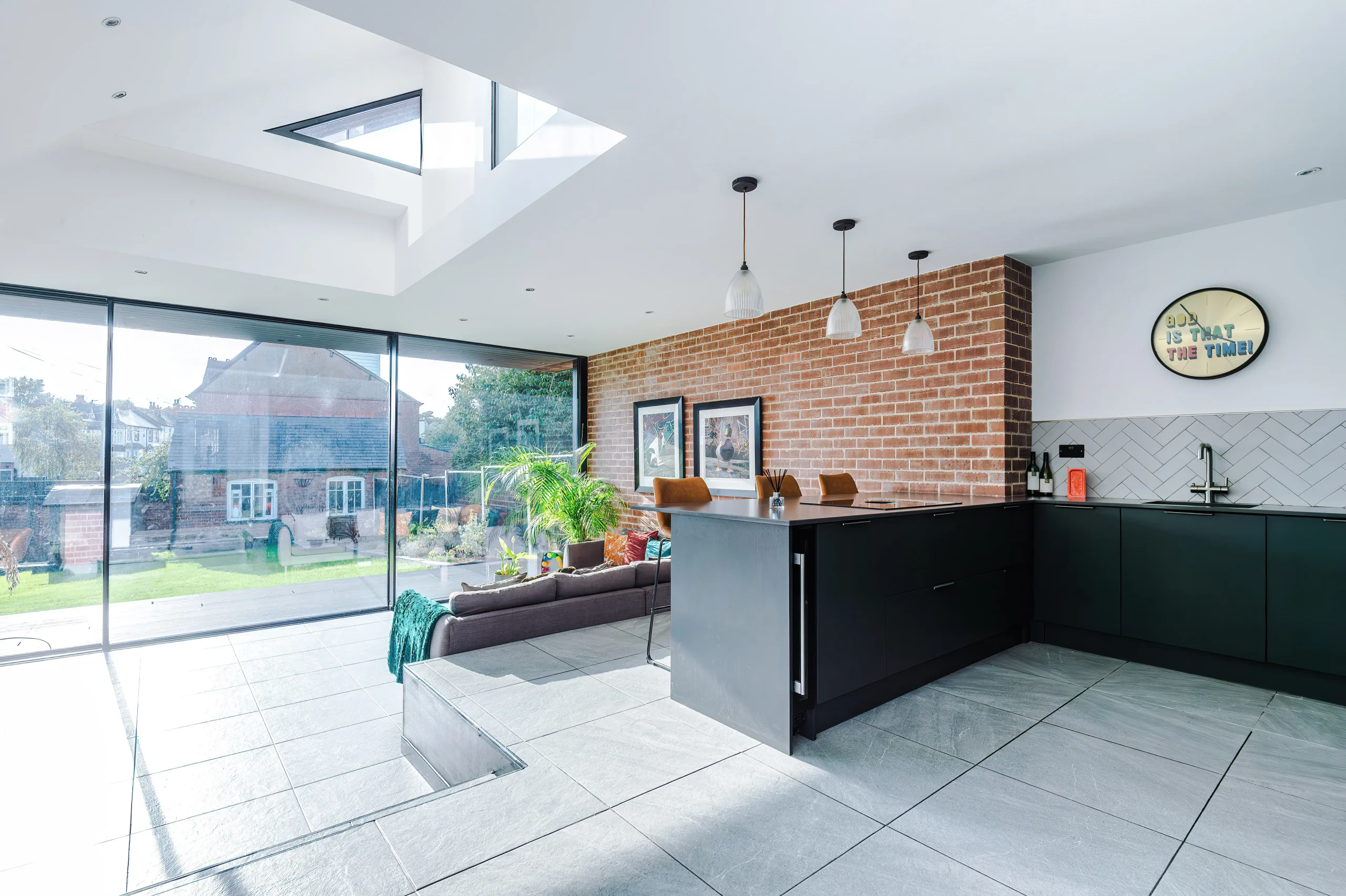 Open plan space links lounge and kitchen