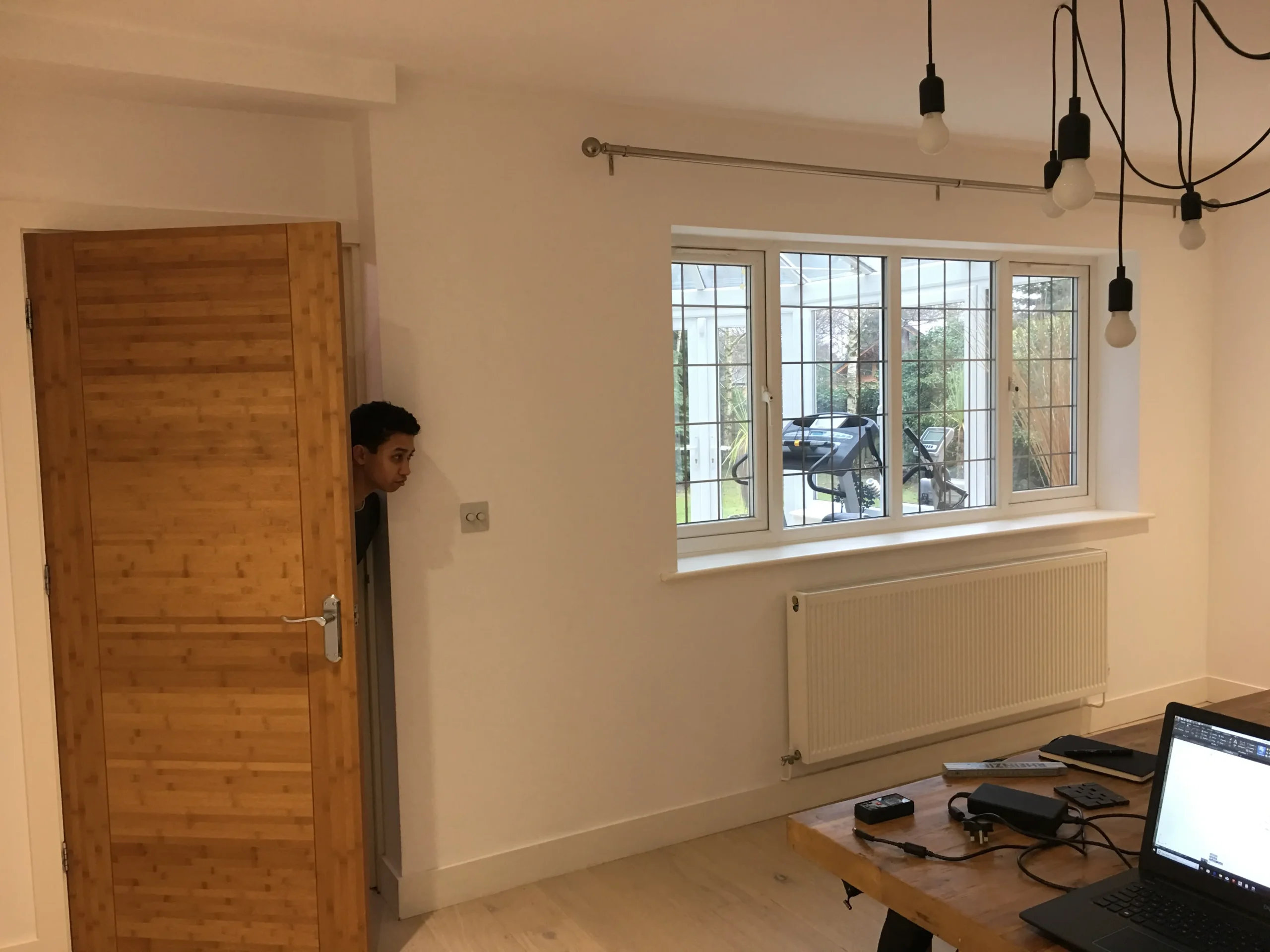 ‘Before' shot of the existing dining room with a view across the conservatory
