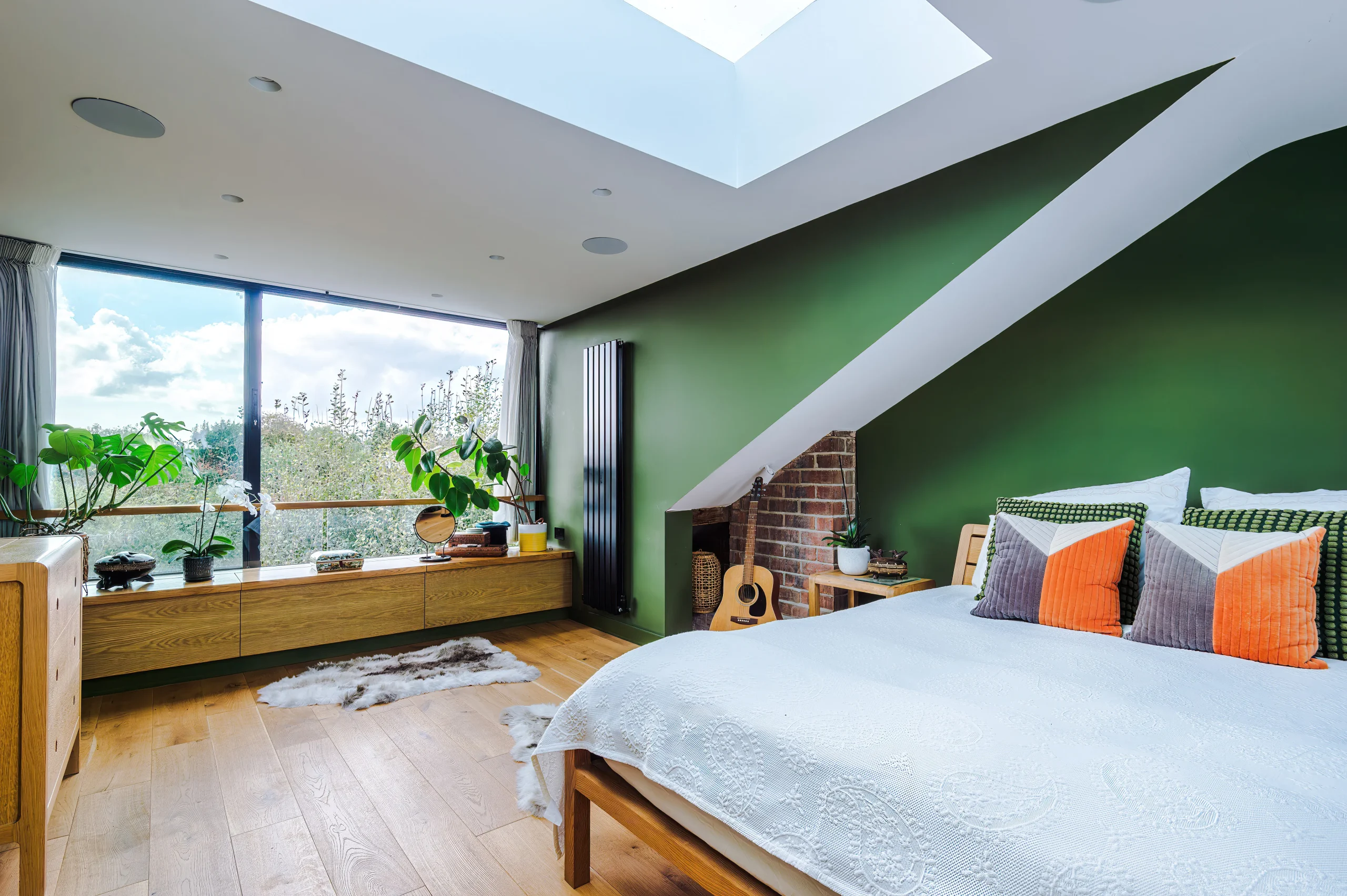 The dormer features a sliding door, a window seat and a rooflight.