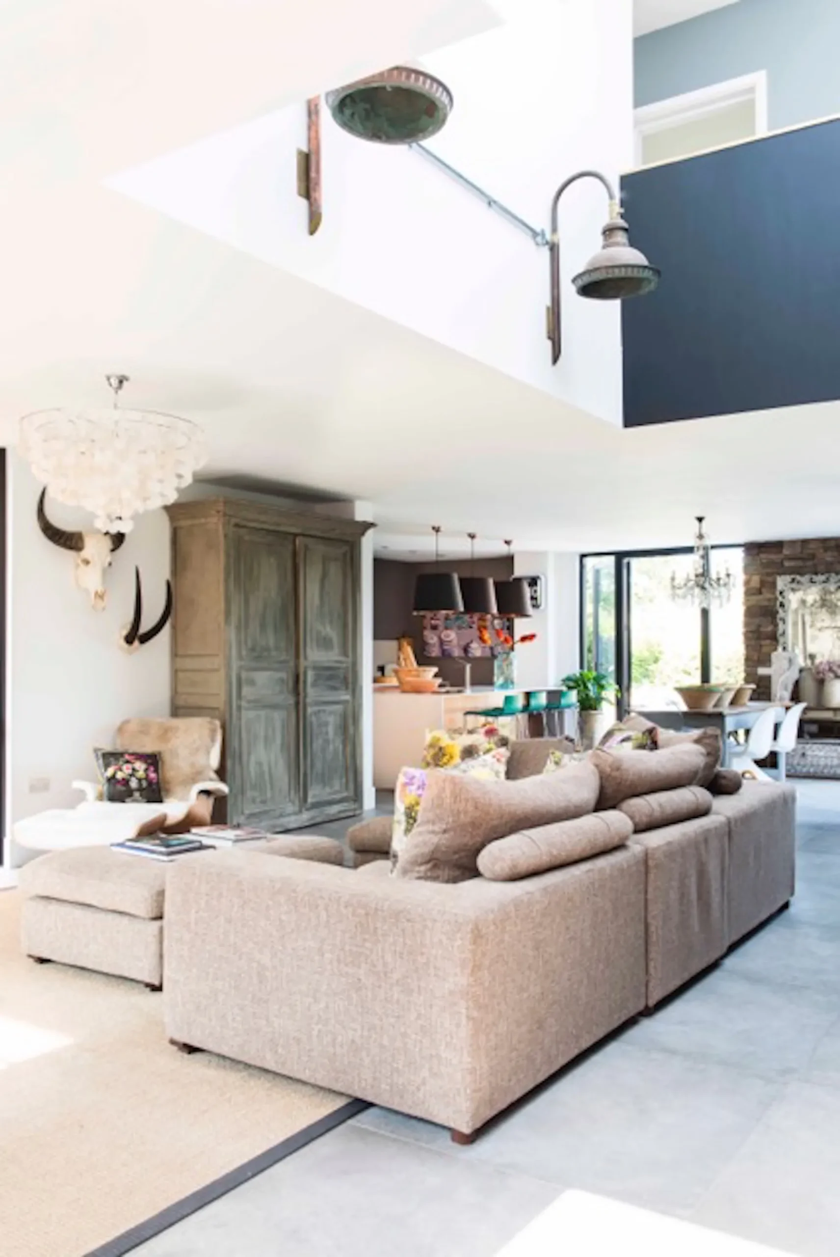 Open plan lounge liking with dining, kitchen and double height void over entrance hall.