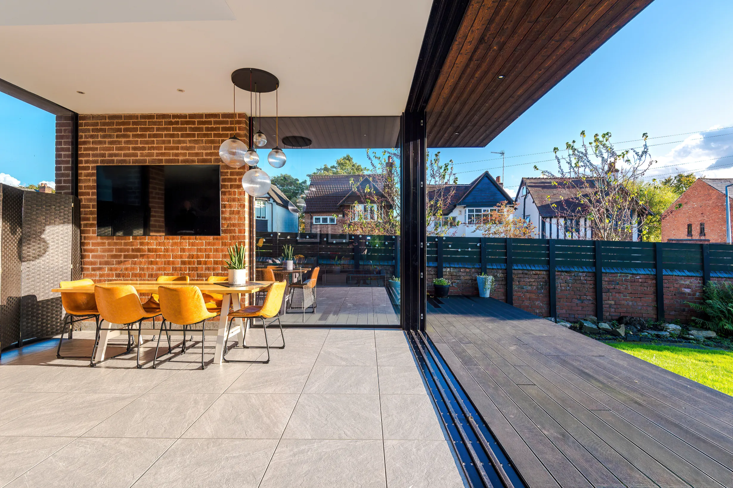 View straddles inside and outside spaces with large sliding doors fully open