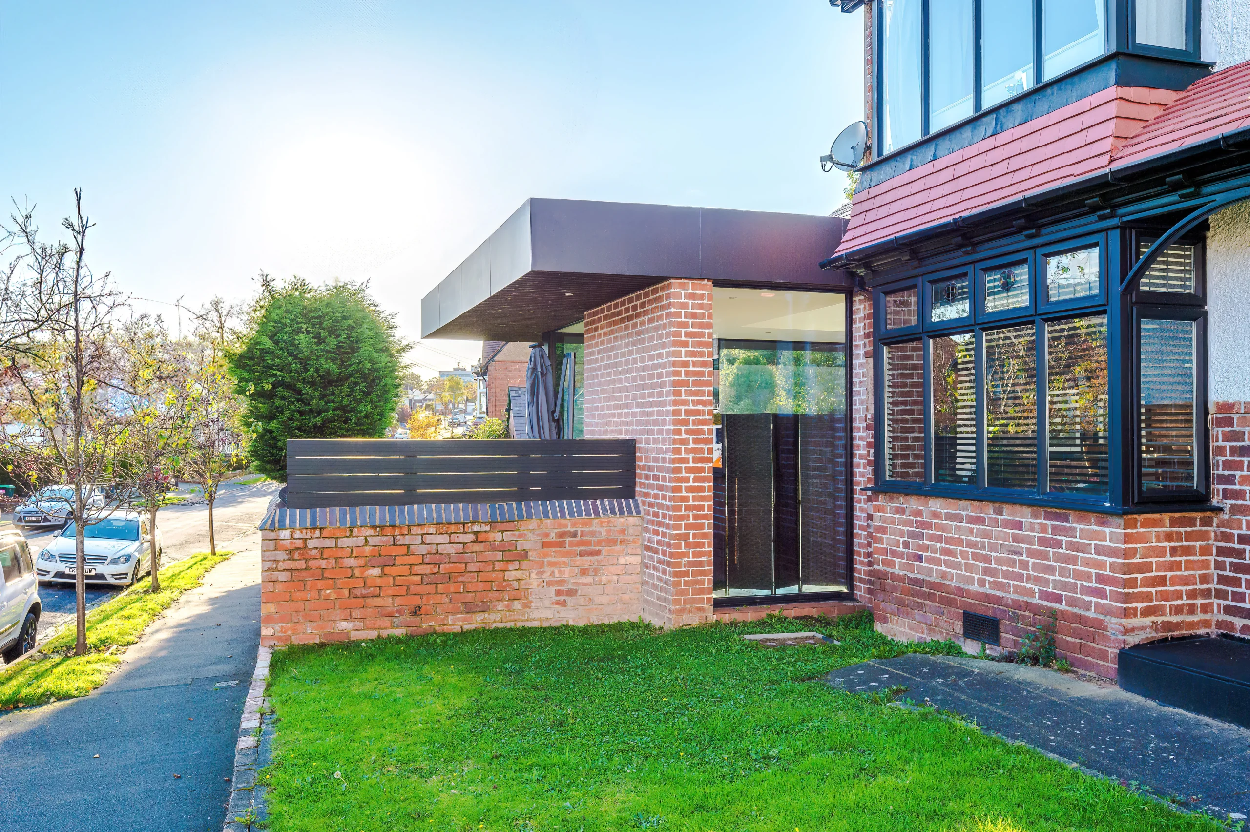 View of corner aspect, with side extension providing a hint of more dramatic changes to the rear