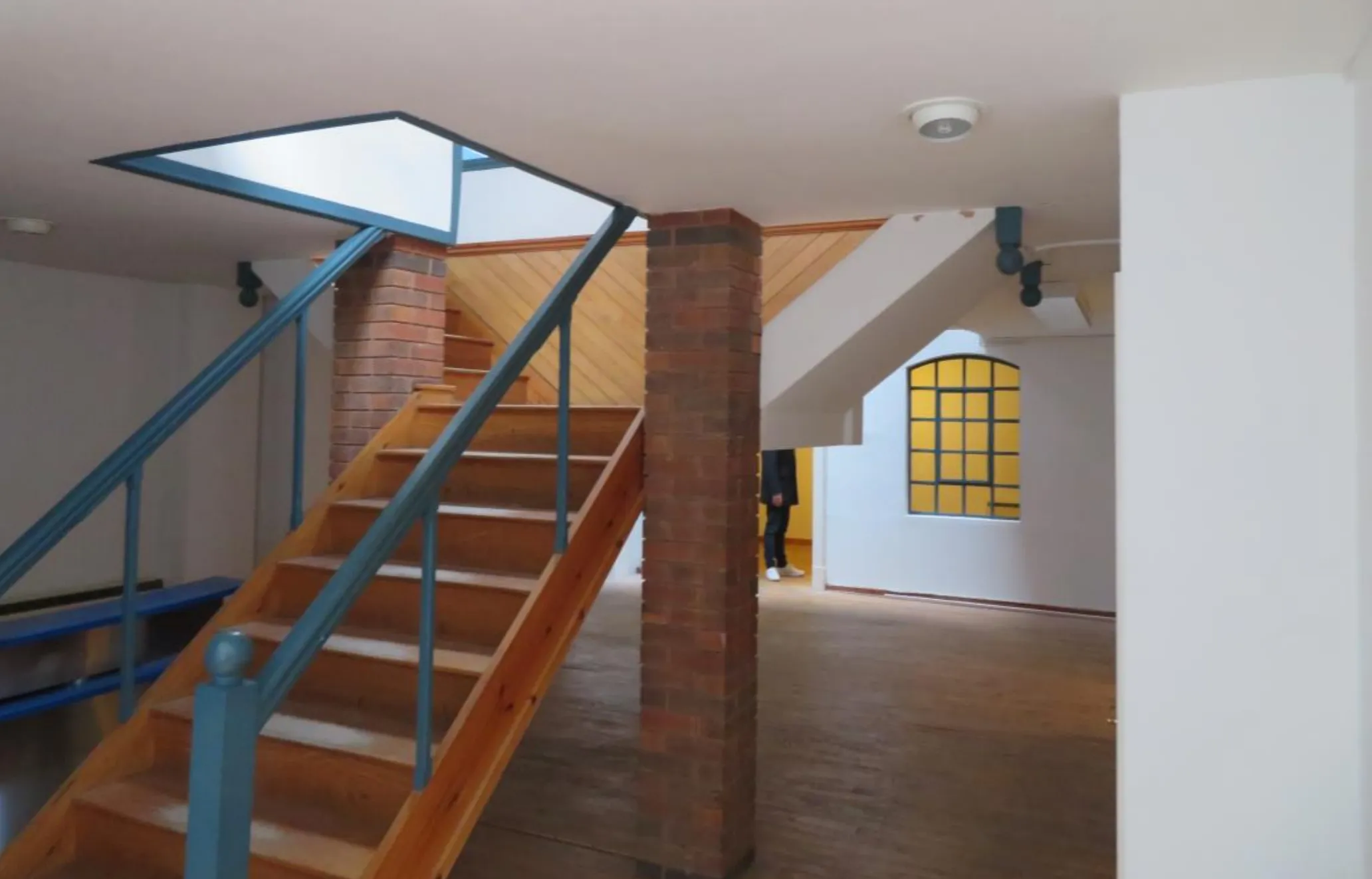 ‘Before’ photograph illustrating how the stair overwhelms the ground floor office space