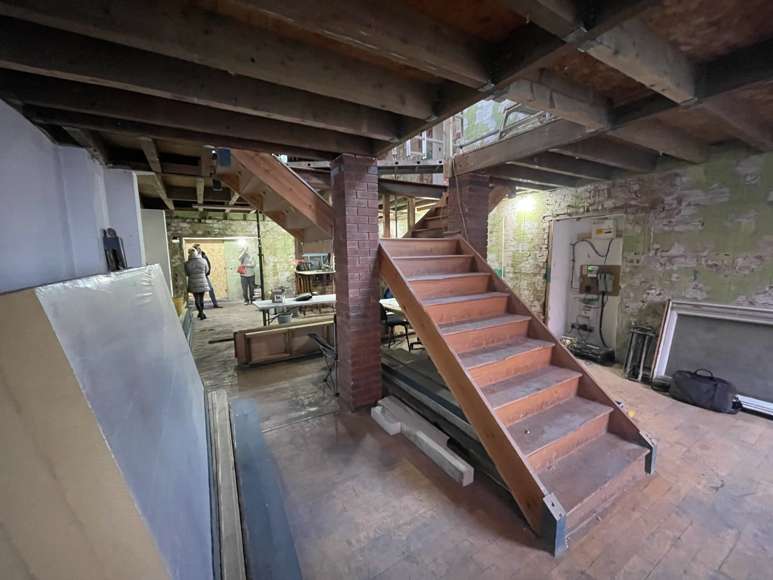 Photograph showing site works in progress, with existing stair still in place