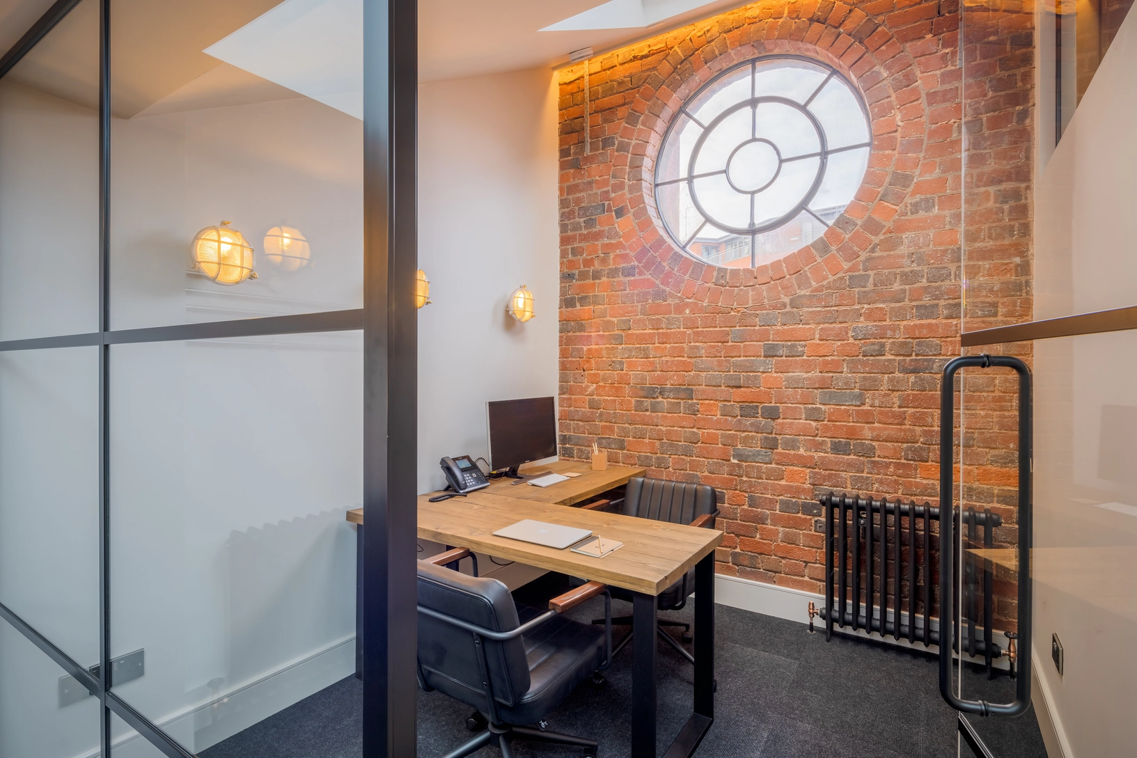 One-person office for confidential working. Crittall style glazed screen provides visual connection with the adjacent open plan office