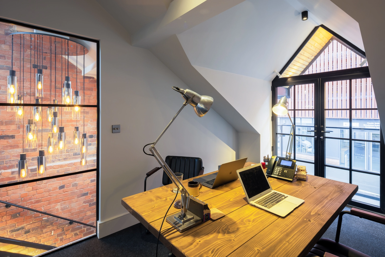 Directors’ office with re-shaped dormer and balcony, and internal window looking across double height space