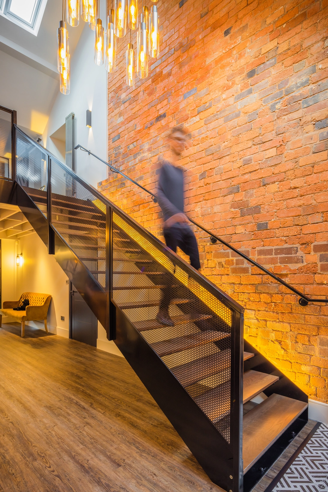 New stair with timber treads and metal mesh balustrade