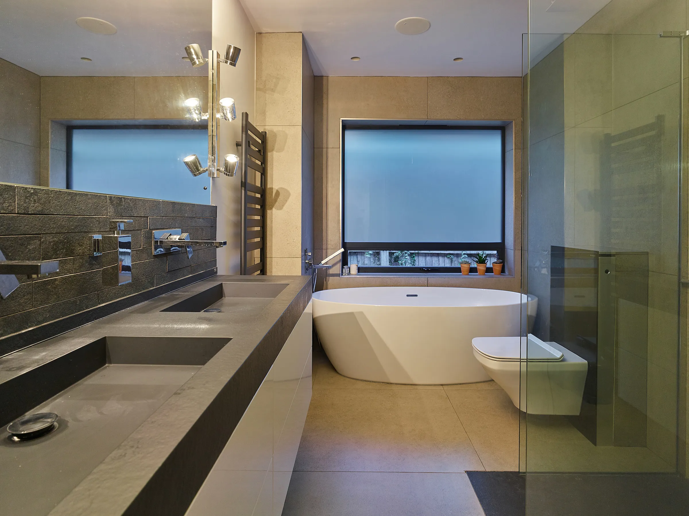 Bathroom with double sink and flush shower