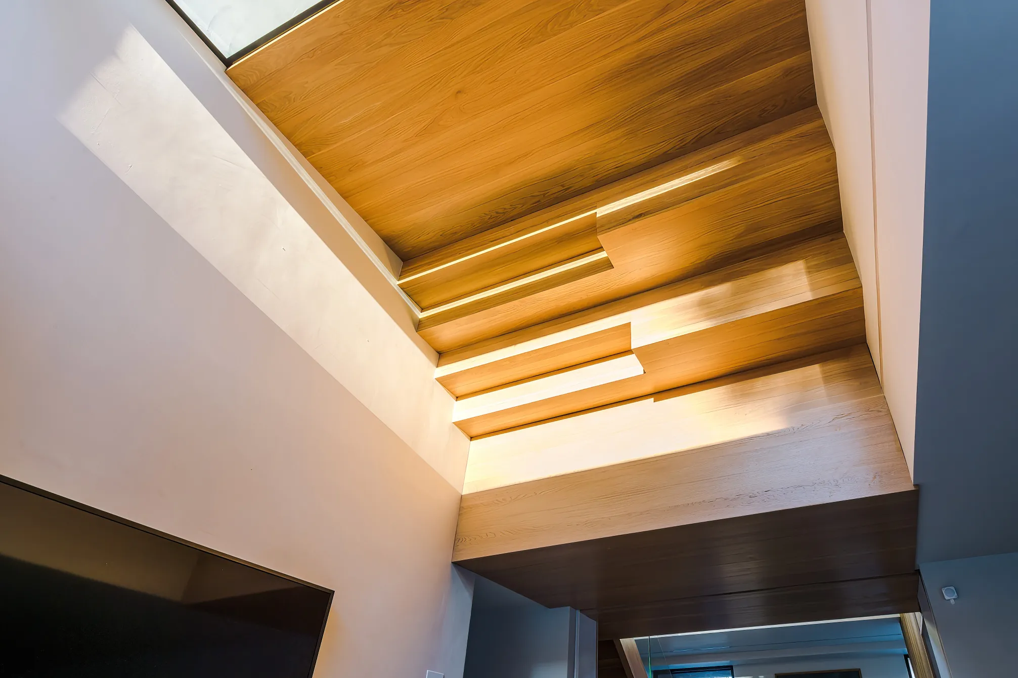 Underbelly of loft stair viewed from open plan dining zone.