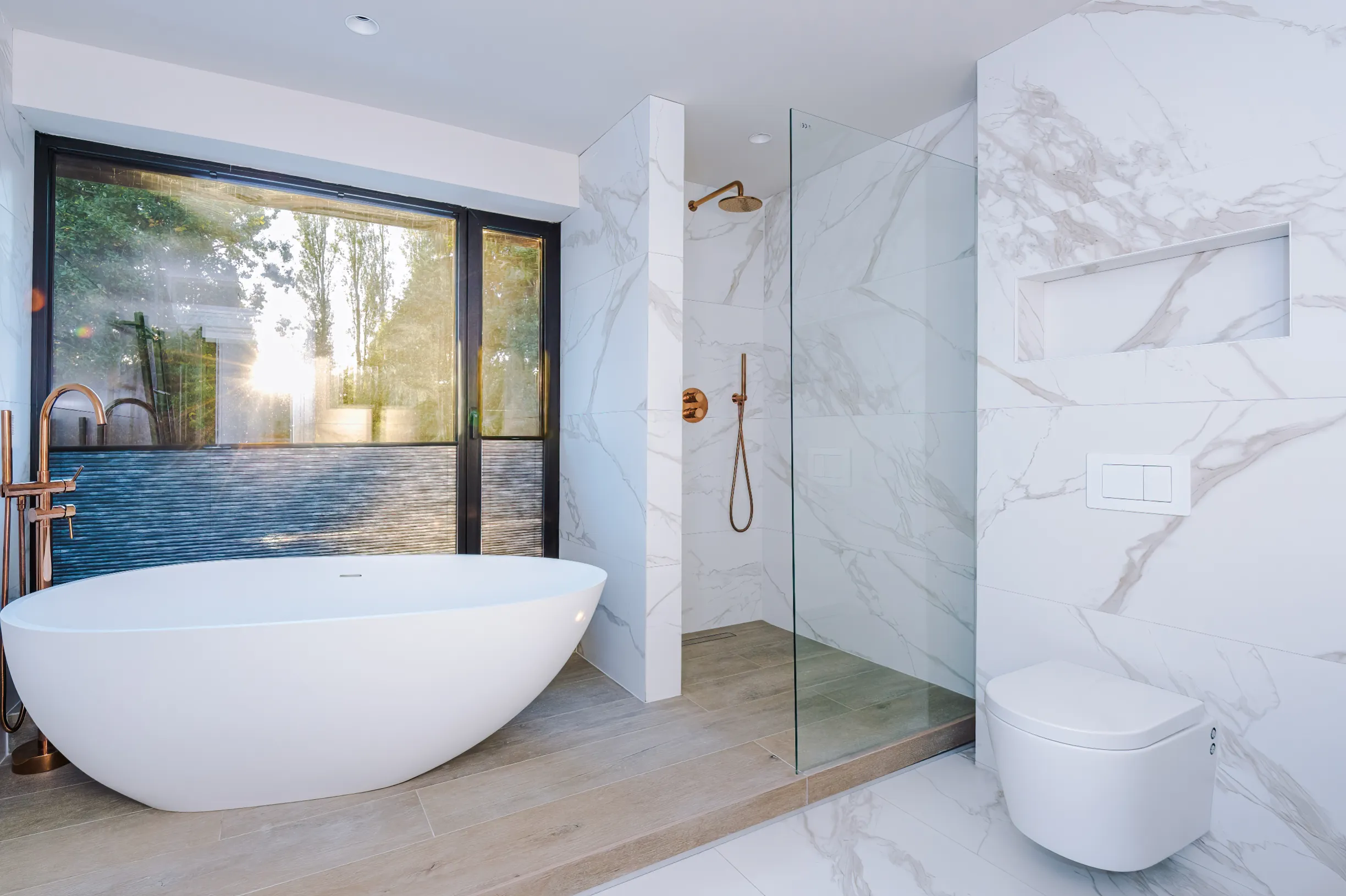 Master en suite, with shower and bath raised on pedestal. Blinds raised upward for privacy when needed.