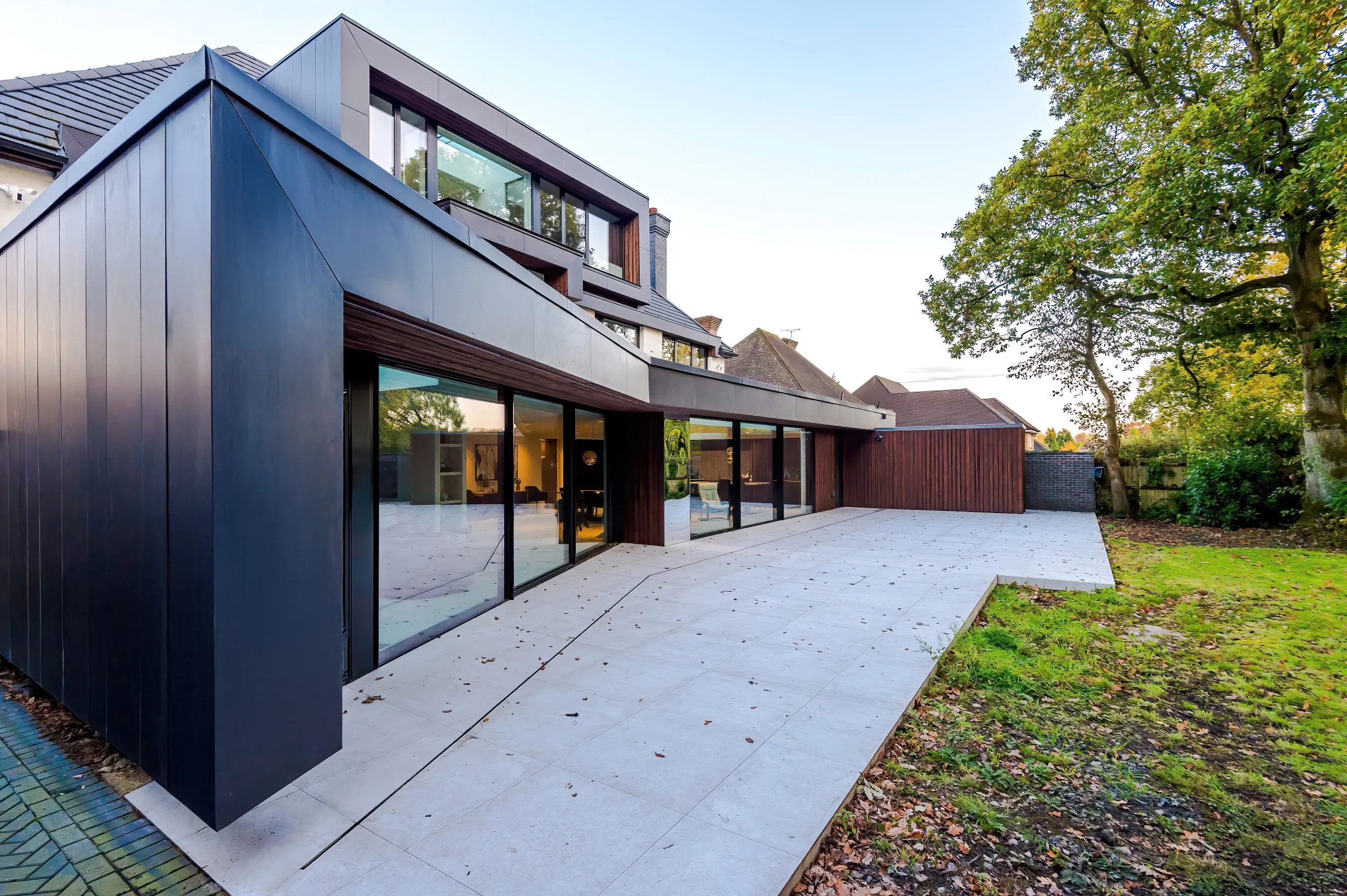 A full width canopy at ground floor addressing the open plan, multi-zone space, and reiterated at the upper levels.