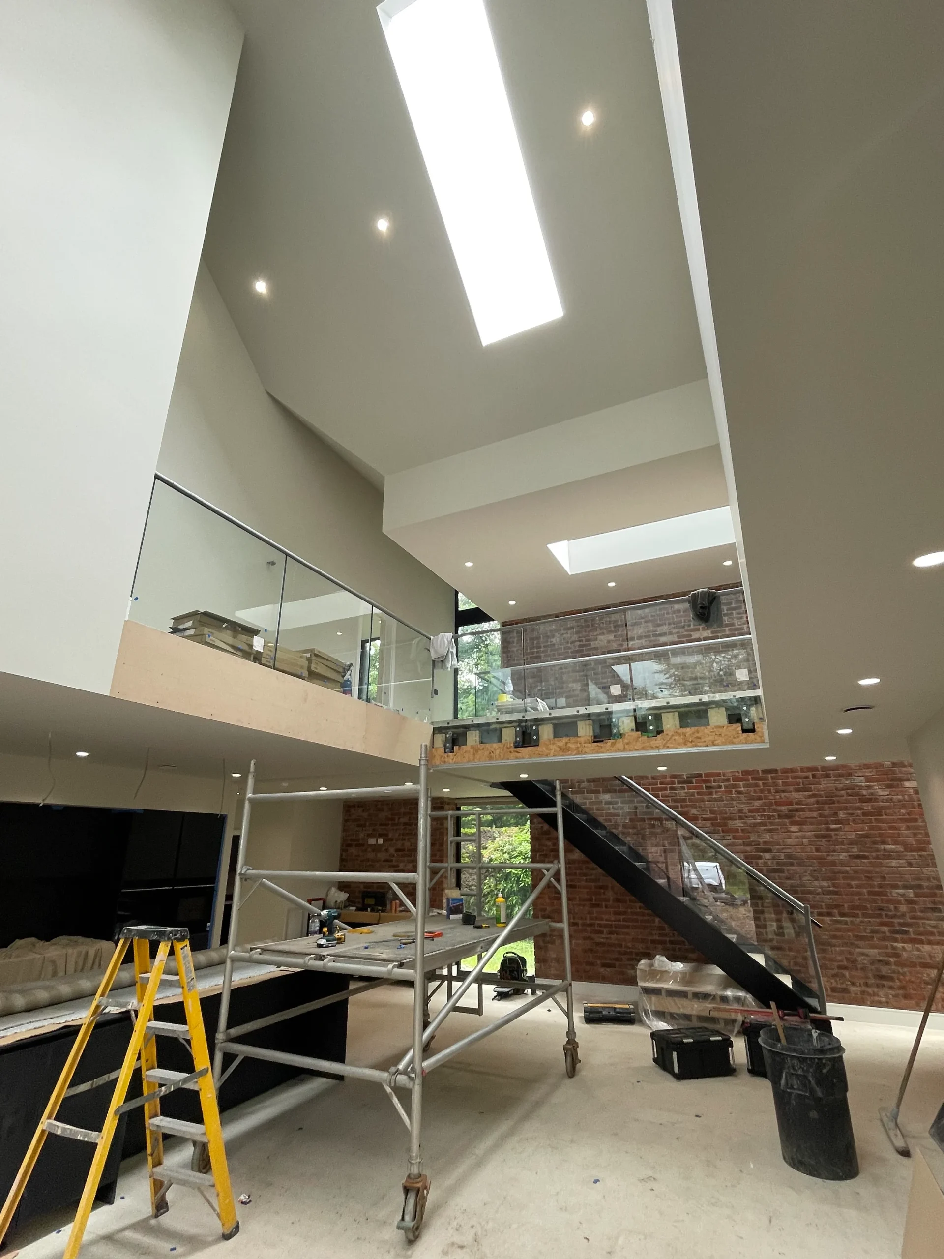 View of atrium showing first floor landing bridge and sculpted ceiling-scape