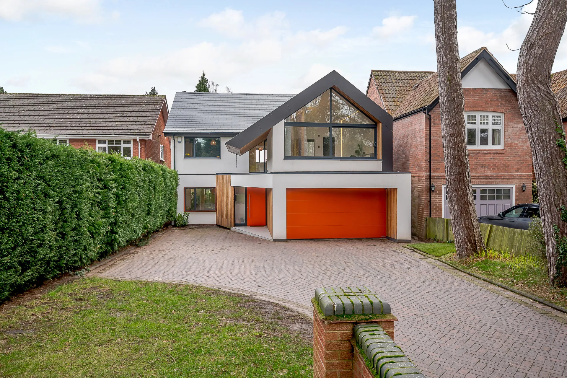 View modernised dwelling frontage with bedroom extension over garage