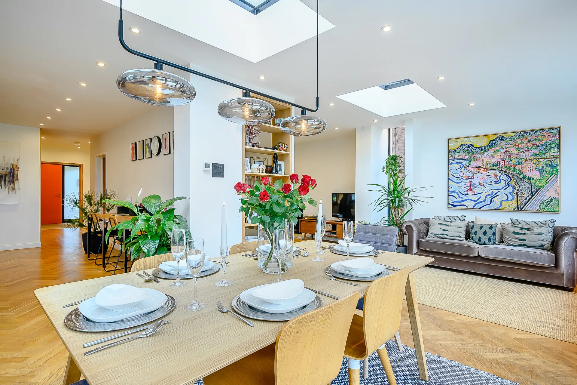 Open plan space linking dining with entrance hall and reading nook