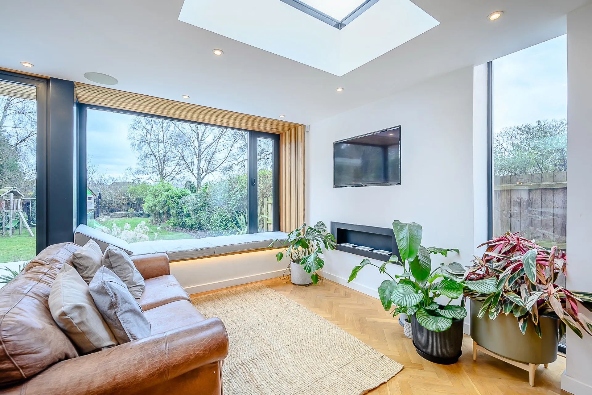 Lounge with recess fireplace and window seat