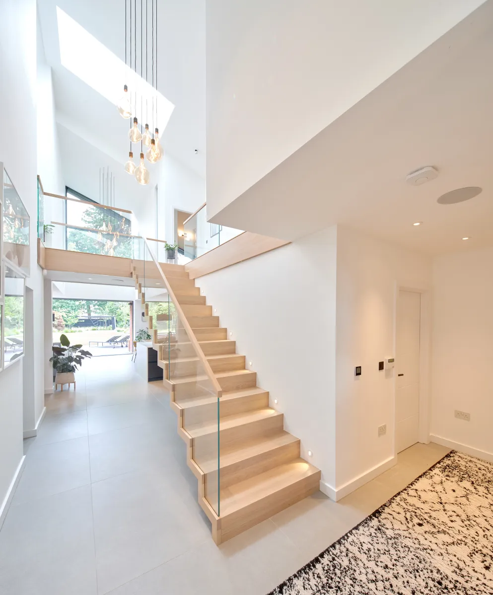 2.5 storey atrium that runs from front to back of house