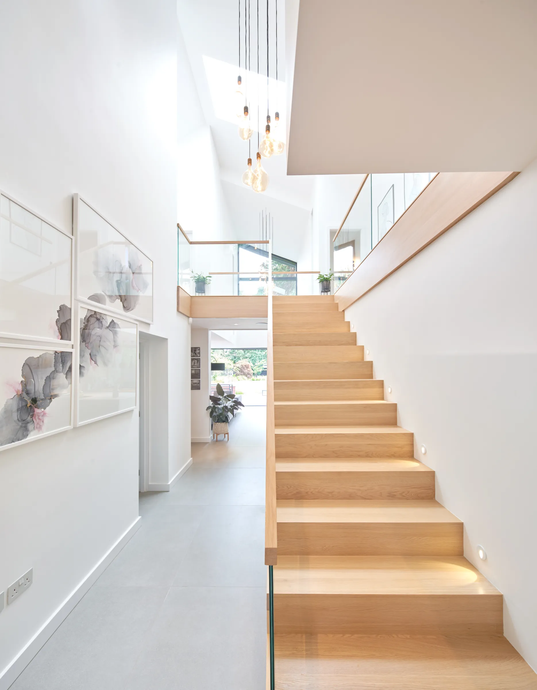 2.5 storey atrium that runs from front to back of house