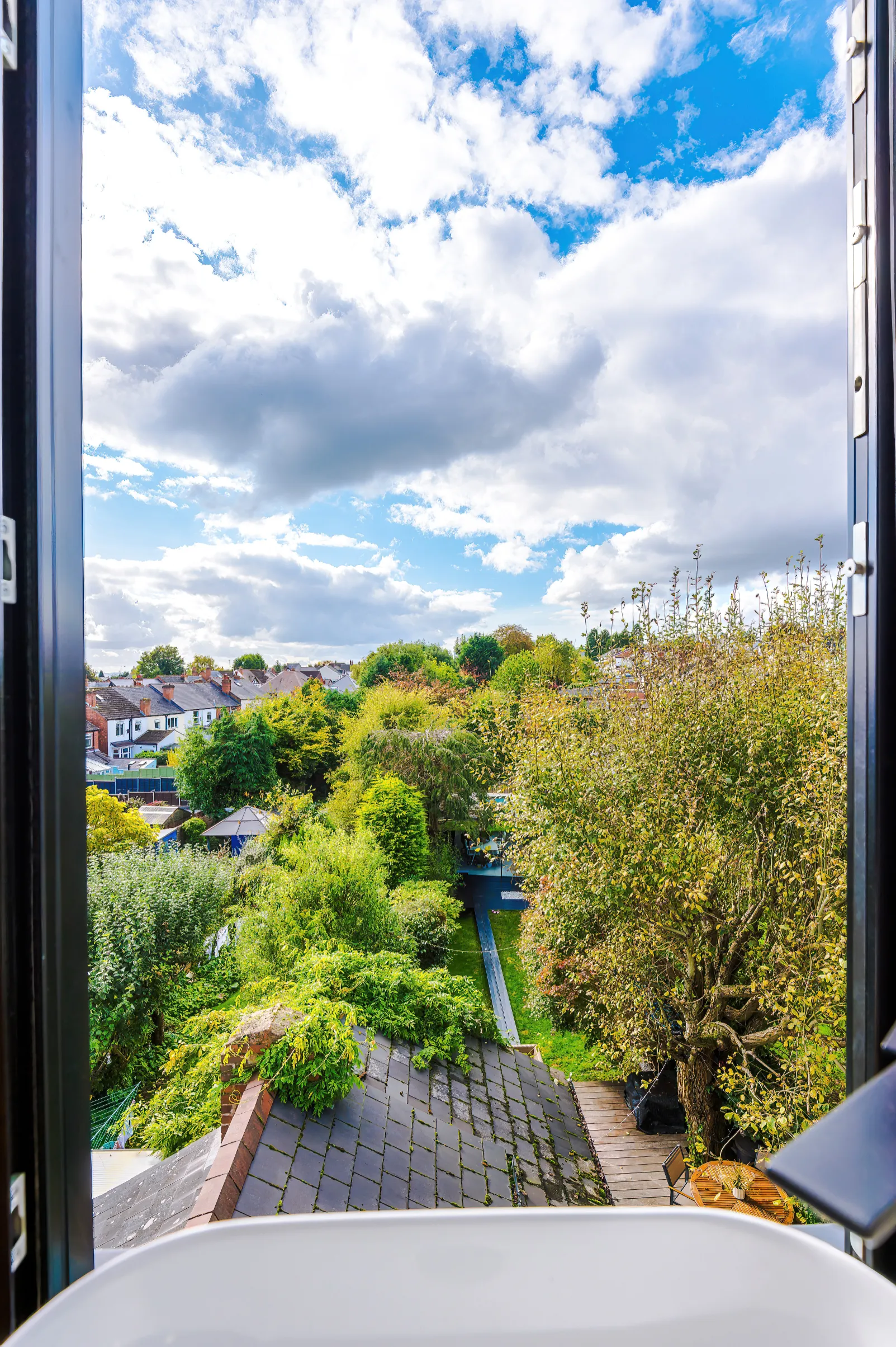 Impressive view and sense of openness when the sliding door is opened across the en suite sink.