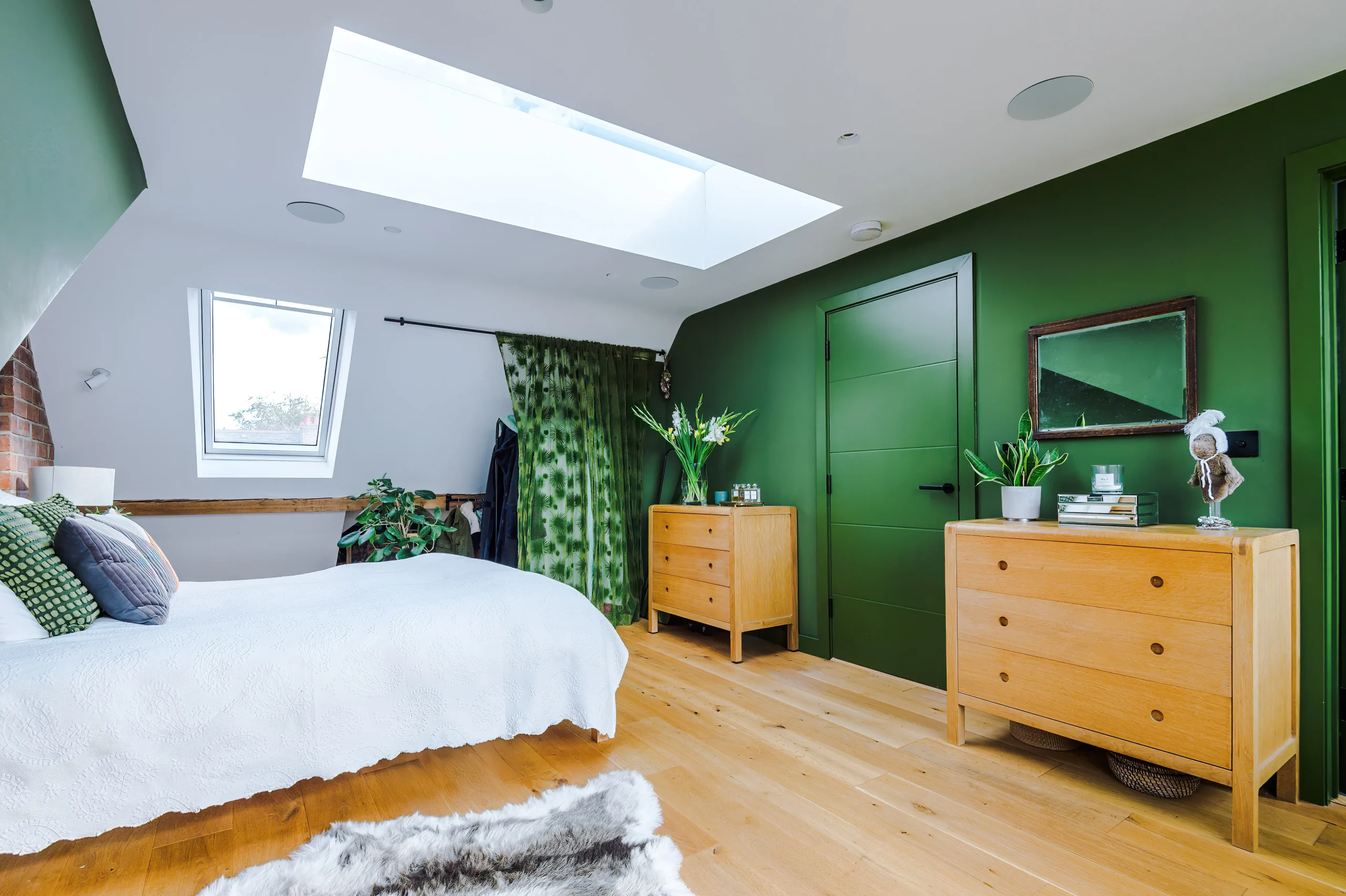 View of bedroom looking toward the front of the dwelling. Wardrobe is kept flexible behind a curtain to occupy minimum space.