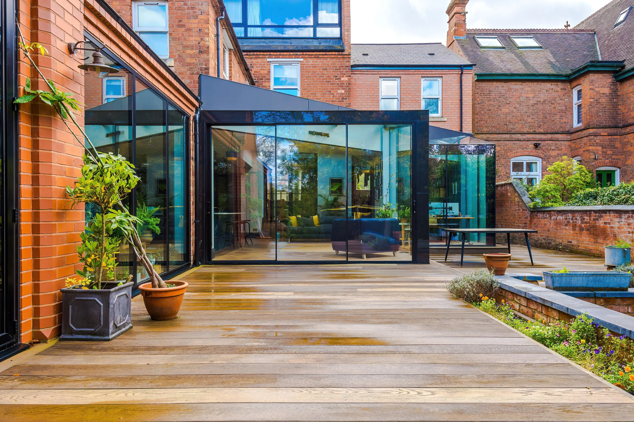 View of the glass cubes extensions and the new composite timber terrace.