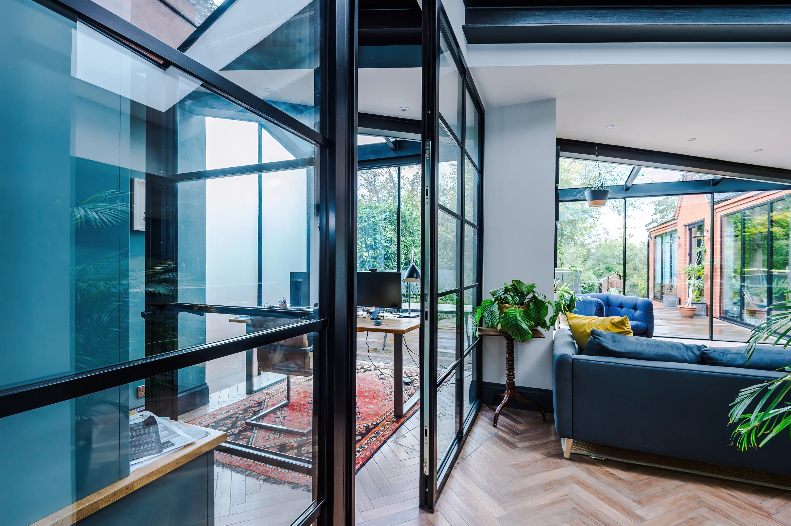 Crittall style glazed screens provide a flow of light and space whilst separating key functions